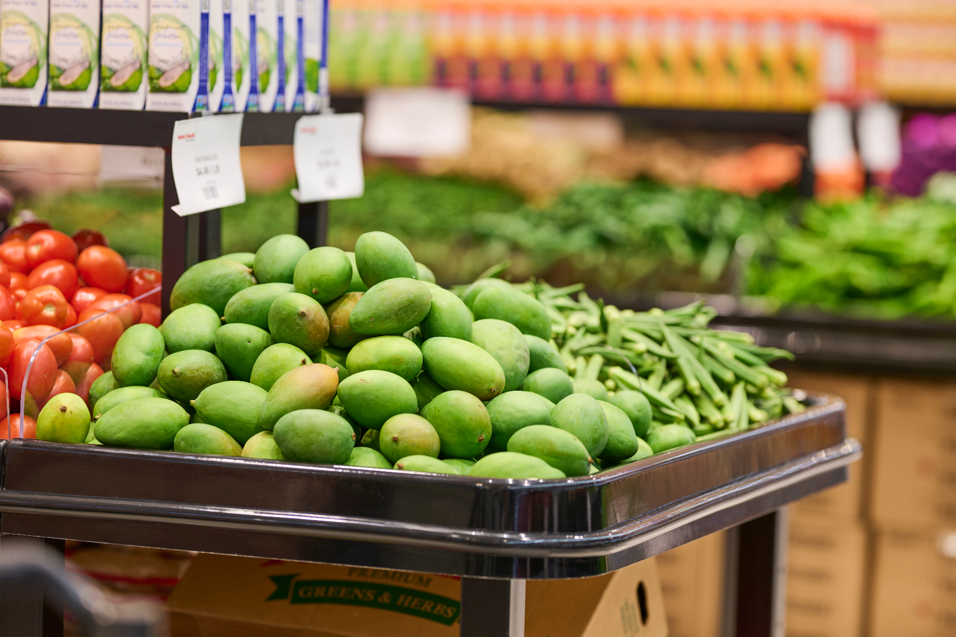 Fresh green mangoes and produce at Subzi Mandi